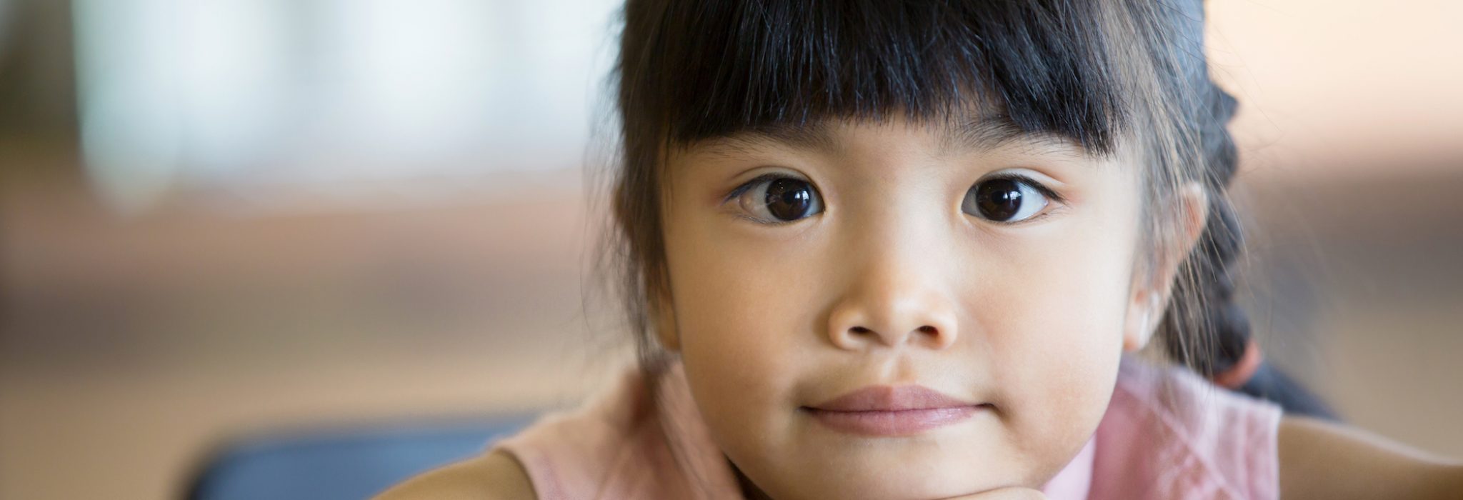 Portrait of a little Asian child girl looking at camera